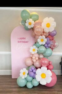 Balloon decor with two arches and single floral garland