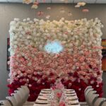 Gradient flower wall with seamless color transitions from blush to deep rose, featuring a mix of realistic silk blooms