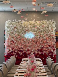 Gradient flower wall with seamless color transitions from blush to deep rose, featuring a mix of realistic silk blooms