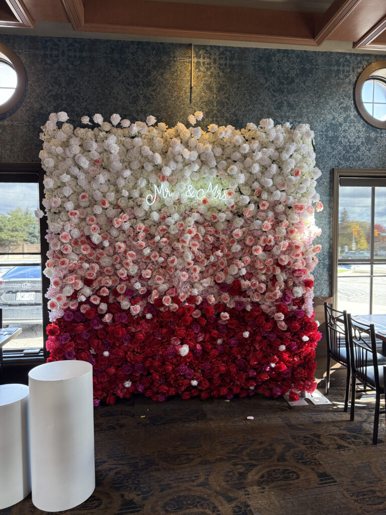 Luxury gradient flower wall featuring red, white, and pink blooms — perfect for weddings, bridal showers, and special events in Vaughan and the GTA.