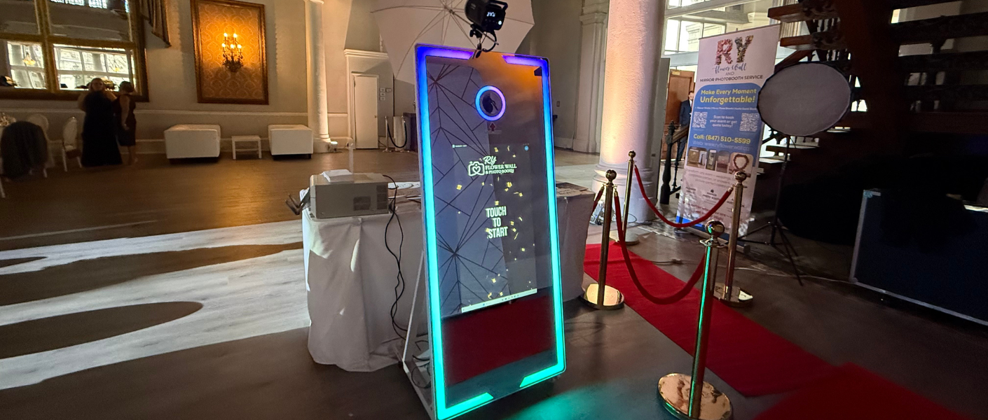 Photo booth setup with backdrop and props at event in Ontario